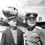 Герой Советского Союза Федот Орлов вместе с Алексеем Сарсковым  на фоне подаренного им самолета Ли-2.