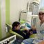 Врач-ортодонт Василий Алексеев принимает  маленького пациента. Фото предоставлены  стоматологической  поликлиникой